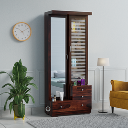 dark sheesham dressing table with sliding mirror door
wooden wardrobe dressing table with storage cabinet
modern dark wood vanity with mirror and drawers
compact dressing table with shelves India
sliding mirror dressing cabinet wooden